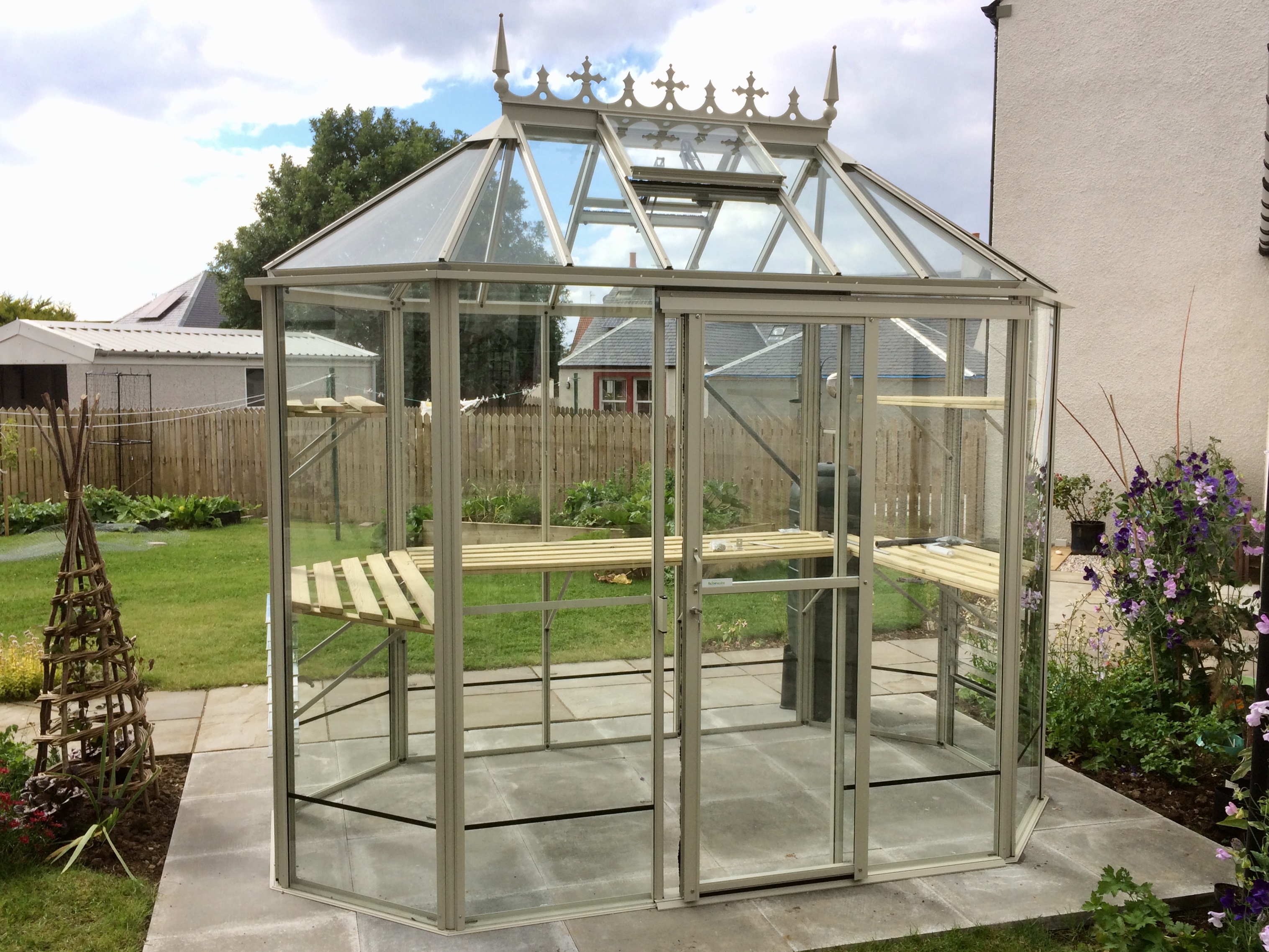 Small white pointy greenhouse